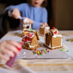 Decorating Gingerbread Houses.